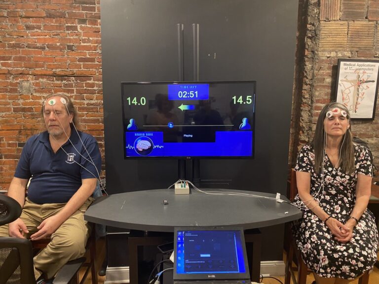 DaiWai Olson and Mary Kay Bader playing brain ball at the Moberg Analytics Intergalactic Headquarters