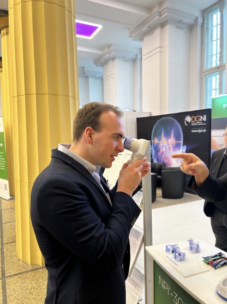 Ethan Moyer with a pupilometer at the DGNI booth at ANIM 2024