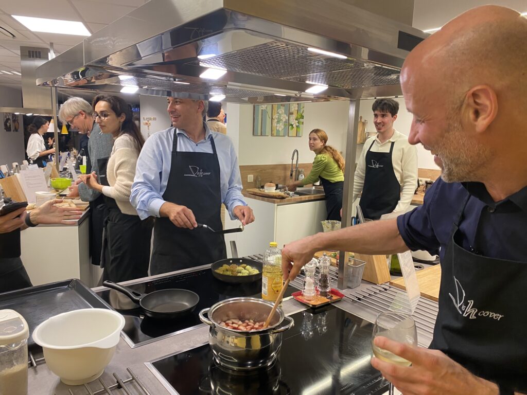 Dr. Raimund Helbok and Dr. Geert Meyfroidt cooking their part of the meal. SOPRANI