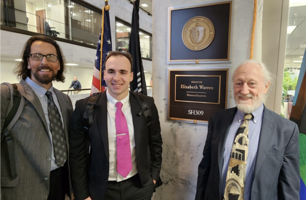 Craig Maddux, Ethan Moyer, and Dick Moberg outside of Senator Elizabeth Warren's office in Washington, D.C.