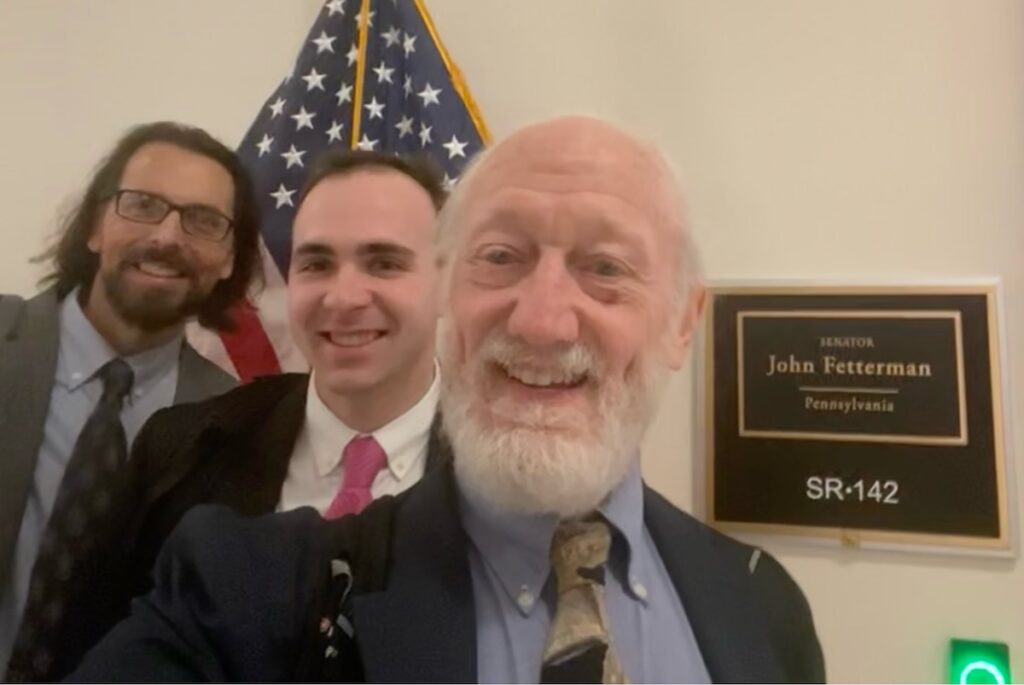 Craig Maddux, Ethan Moyer, and Dick Moberg outside of Senator John Fetterman's office in Washington, D.C.