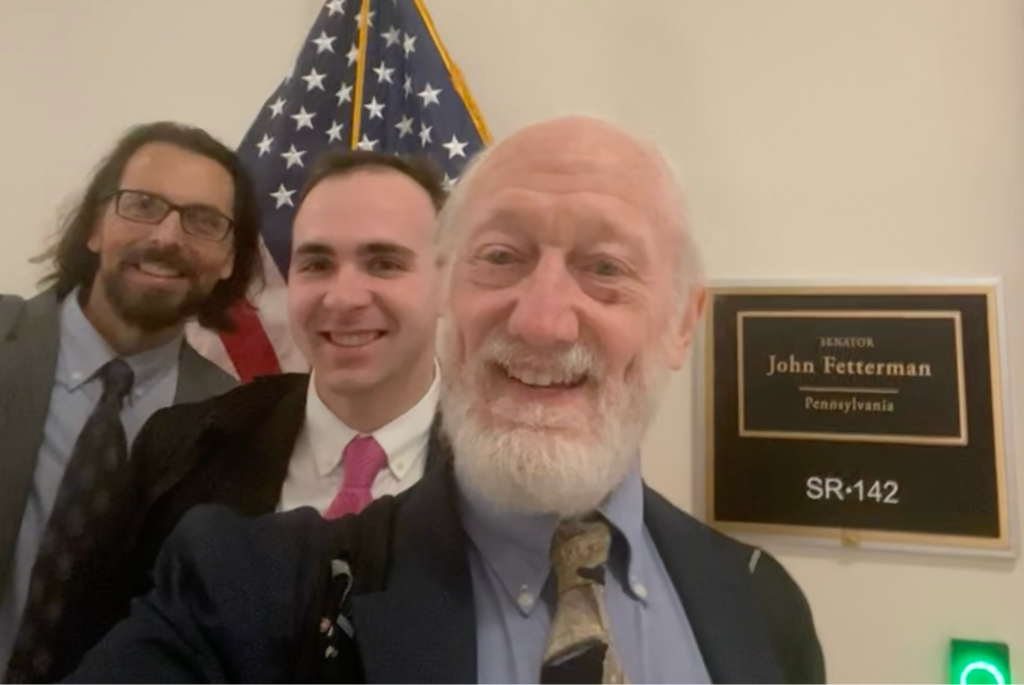 Craig Maddux, Ethan Moyer, and Dick Moberg outside of Senator John Fetterman's office in Washington, D.C.